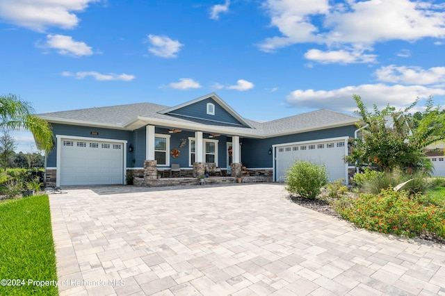 view of front of home featuring a garage and a porch