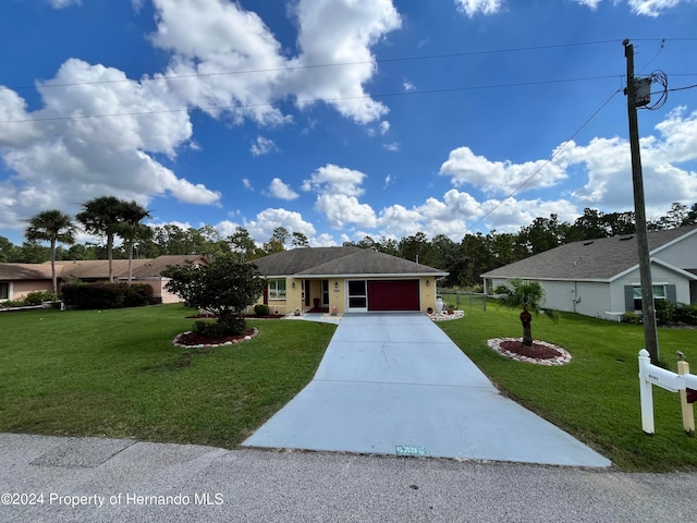 ranch-style home with a garage and a front yard