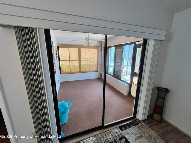 entryway featuring ceiling fan and wood-type flooring