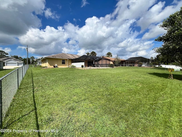 view of yard featuring a lanai