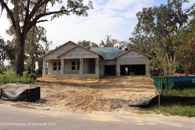 property in mid-construction with a garage