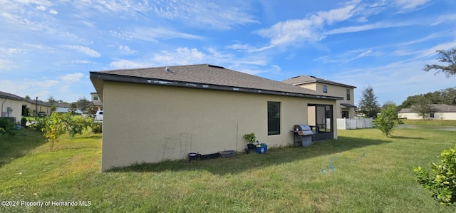 view of property exterior featuring a lawn