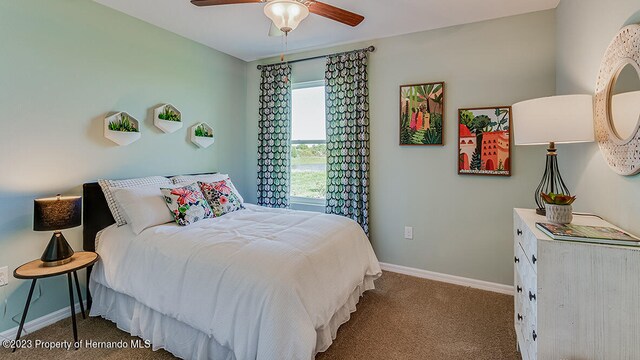 carpeted bedroom featuring ceiling fan