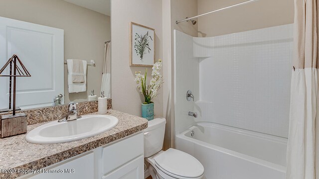 full bathroom featuring toilet, vanity, and shower / bath combination with curtain