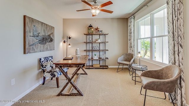 carpeted office featuring a wealth of natural light and ceiling fan