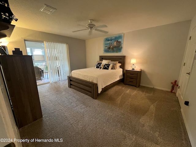 carpeted bedroom with ceiling fan and access to exterior