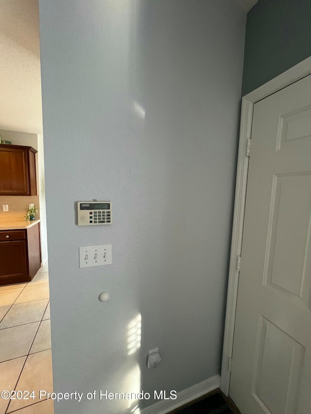 interior details featuring tile patterned floors