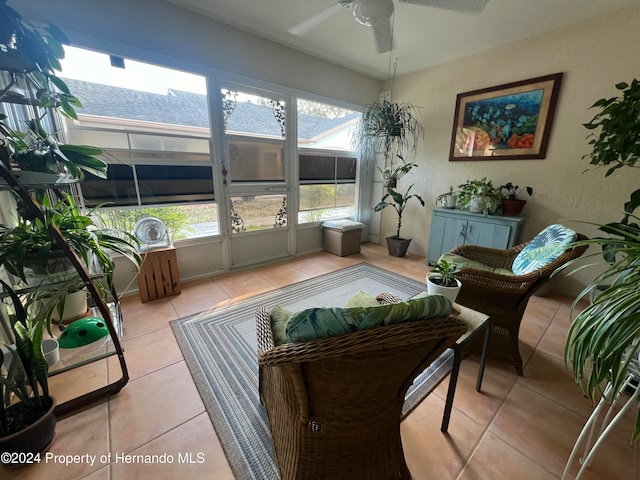 sunroom with plenty of natural light and ceiling fan