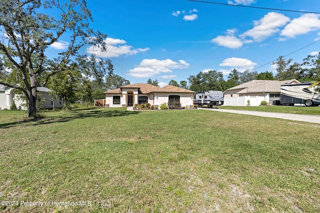 mediterranean / spanish-style home with a front yard