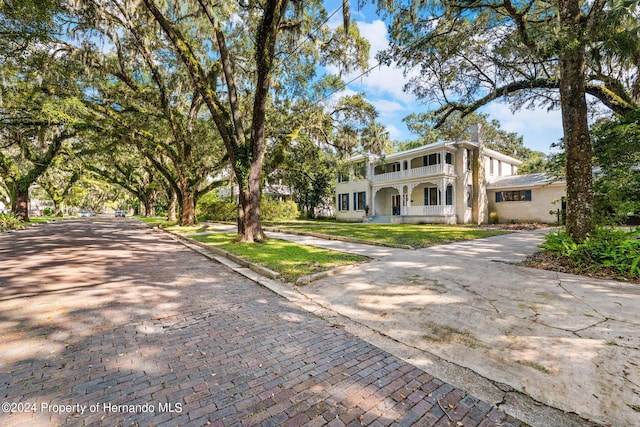 view of front of house with a balcony