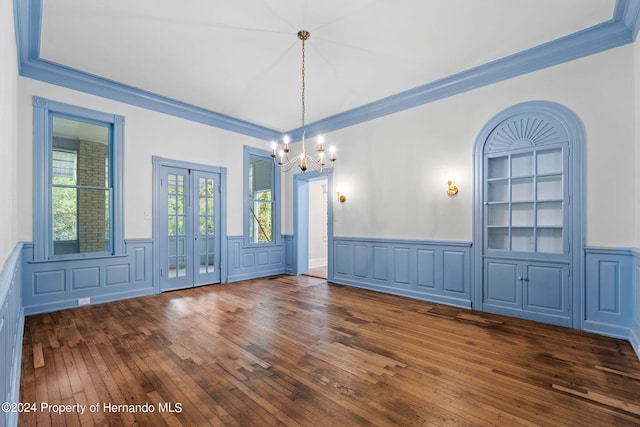 unfurnished dining area with crown molding and dark hardwood / wood-style flooring