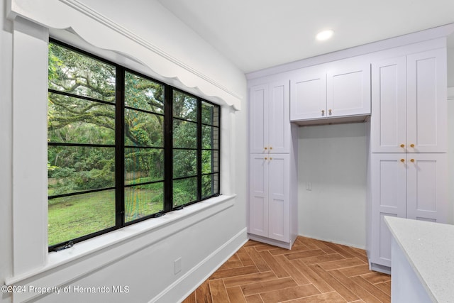 interior space with light parquet floors