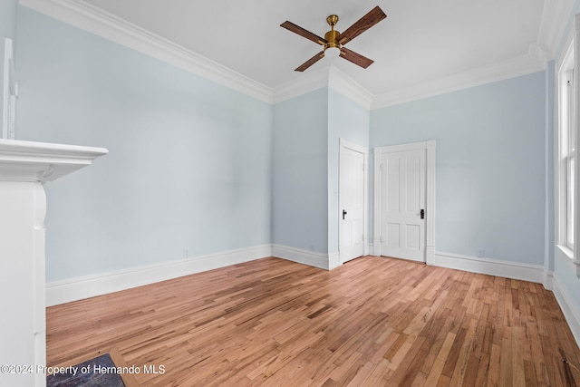 unfurnished room with ornamental molding, light wood-type flooring, and ceiling fan