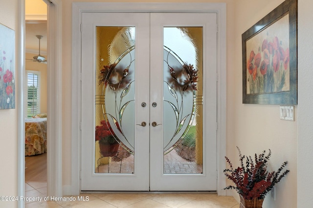 9312 Gentle Ben Ct, Weeki Wachee, FL 34613 - doorway with french doors and tile patterned floors