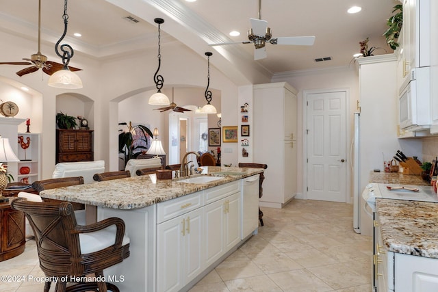 9312 Gentle Ben Ct, Weeki Wachee, FL 34613 - kitchen featuring a ceiling fan, white appliances, white cabinetry, crown molding, and recessed lighting