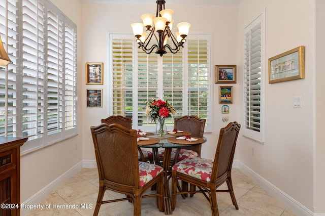 dining room featuring a wealth of natural light, a chandelier, and light tile patterned flooring