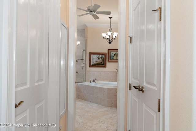 bathroom featuring ornamental molding, ceiling fan with notable chandelier, and shower with separate bathtub