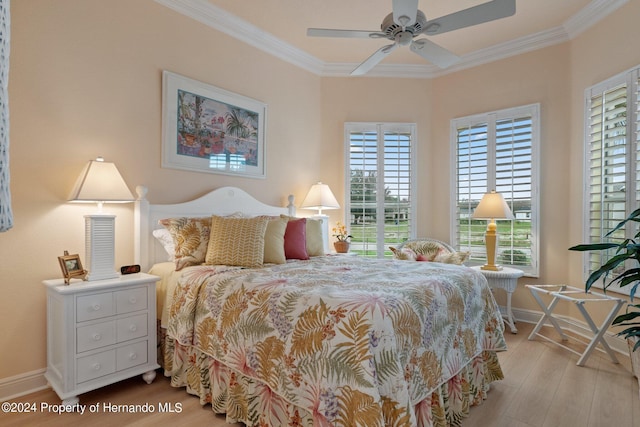 9312 Gentle Ben Ct, Weeki Wachee, FL 34613 - bedroom with ornamental molding, wood finished floors, and a ceiling fan