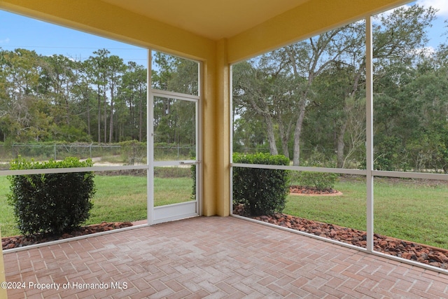 unfurnished sunroom featuring plenty of natural light