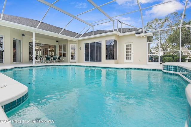 view of pool featuring a patio, a lanai, and ceiling fan