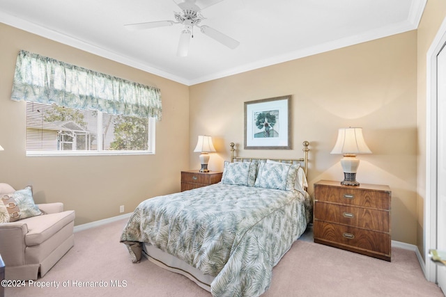 bedroom featuring light carpet, ceiling fan, and crown molding