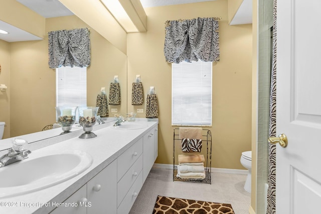 bathroom featuring toilet and vanity