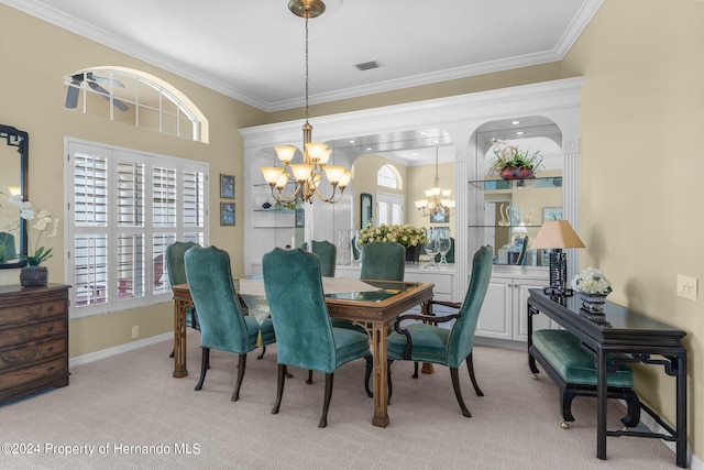 carpeted dining area with ornamental molding and a notable chandelier