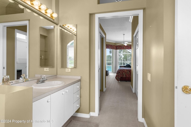 bathroom with vanity and a textured ceiling