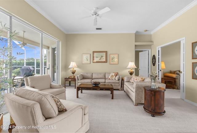 living room featuring ceiling fan, light colored carpet, and crown molding