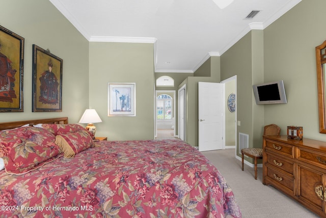 carpeted bedroom with ornamental molding