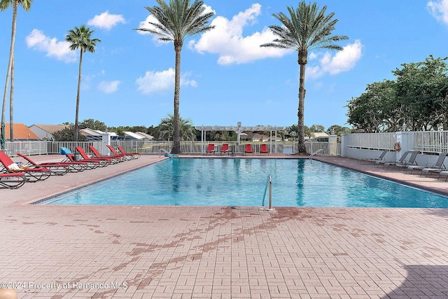 view of swimming pool with a patio