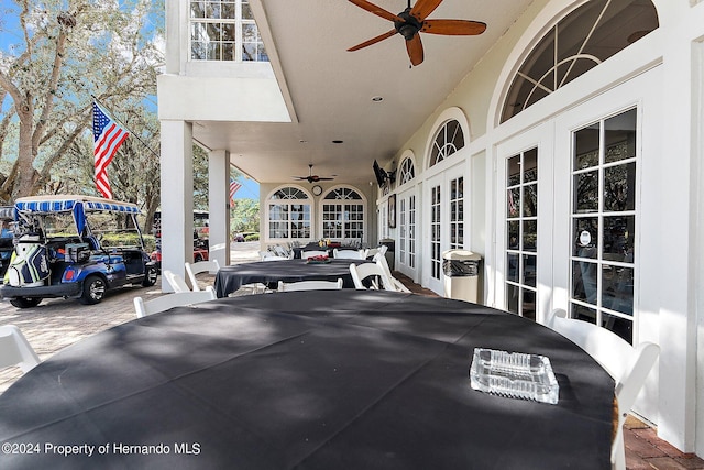 exterior space featuring french doors and ceiling fan