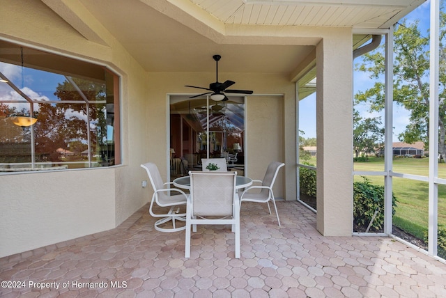 view of patio featuring ceiling fan