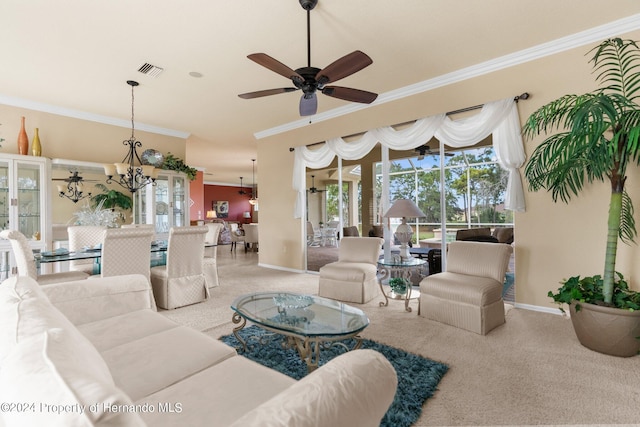 carpeted living room with ornamental molding and ceiling fan with notable chandelier