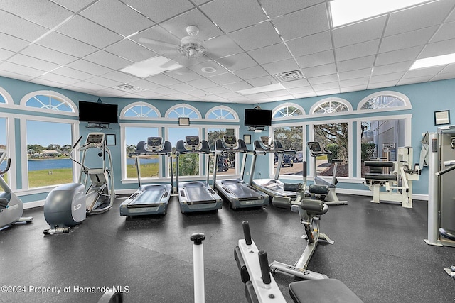 workout area featuring a paneled ceiling and ceiling fan