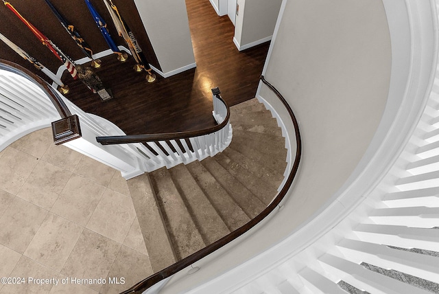 staircase with tile patterned floors