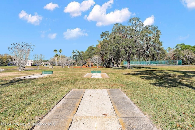 view of home's community featuring a yard