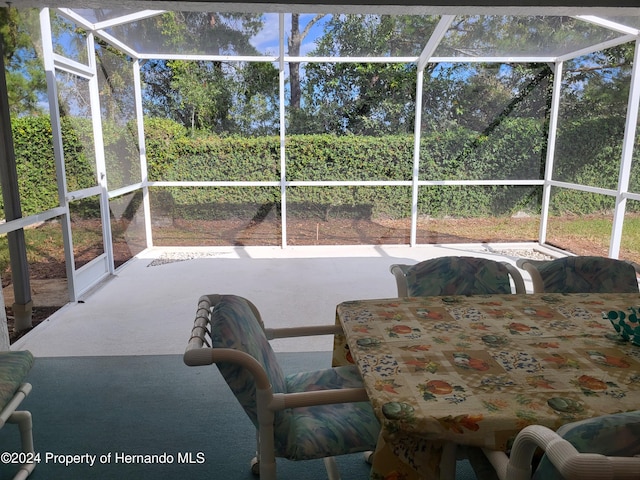 sunroom / solarium featuring a healthy amount of sunlight