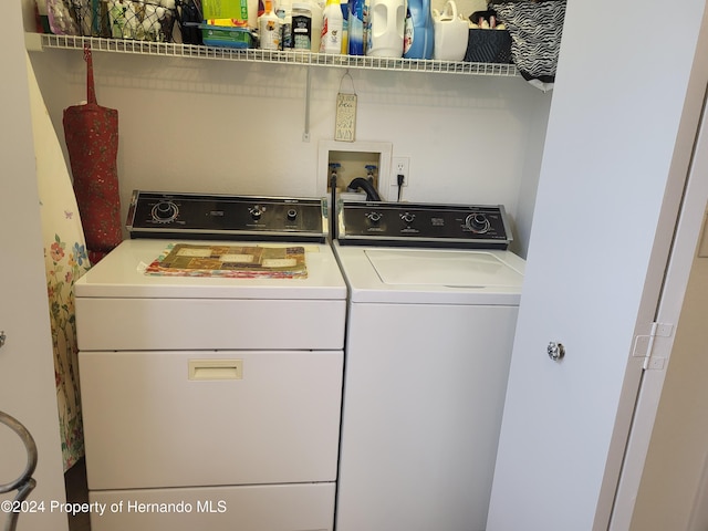 clothes washing area with washer and dryer