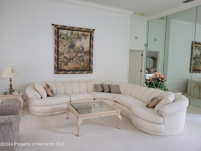 living room featuring ornamental molding and carpet flooring