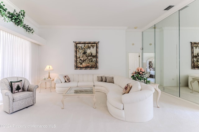 carpeted living room with crown molding