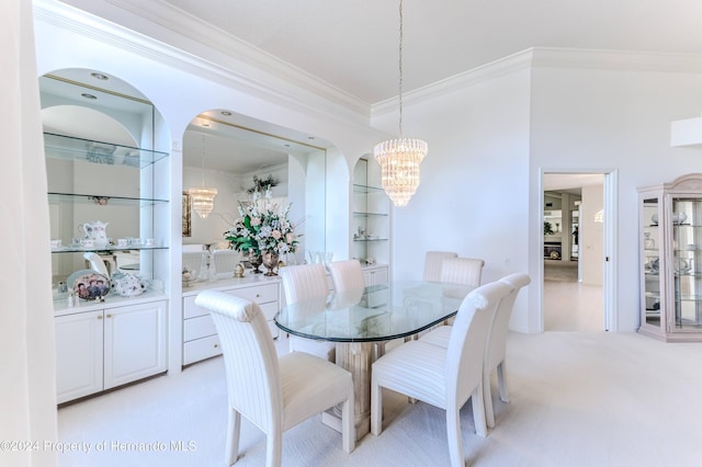 dining area with light carpet, crown molding, a notable chandelier, and built in features