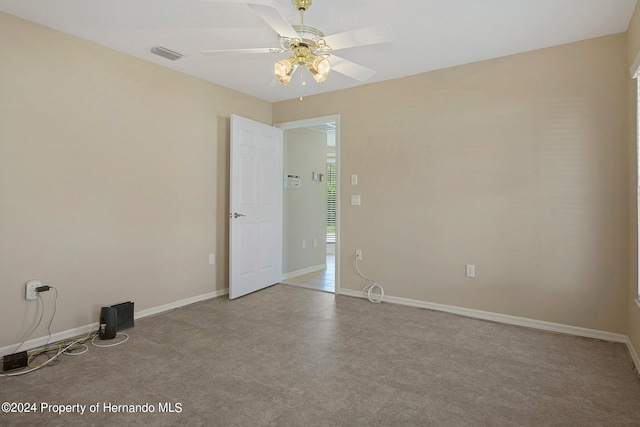 unfurnished room with ceiling fan