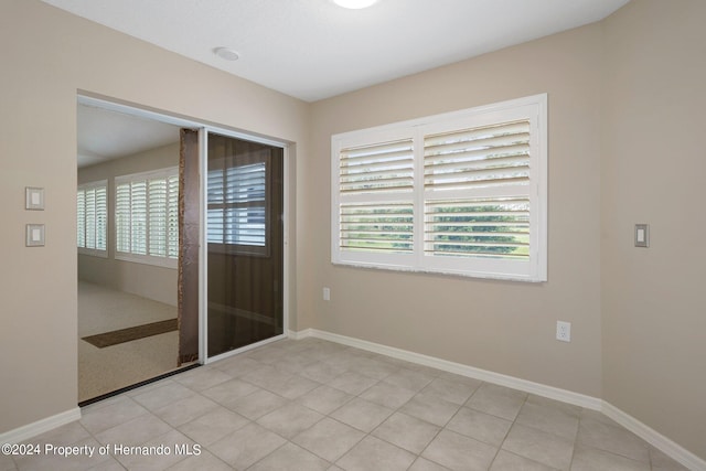 view of tiled spare room