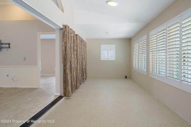 hallway featuring plenty of natural light