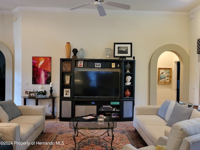 living room with hardwood / wood-style floors, ceiling fan, and ornamental molding