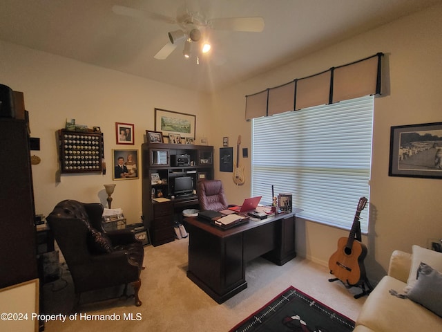 office space with light carpet and ceiling fan