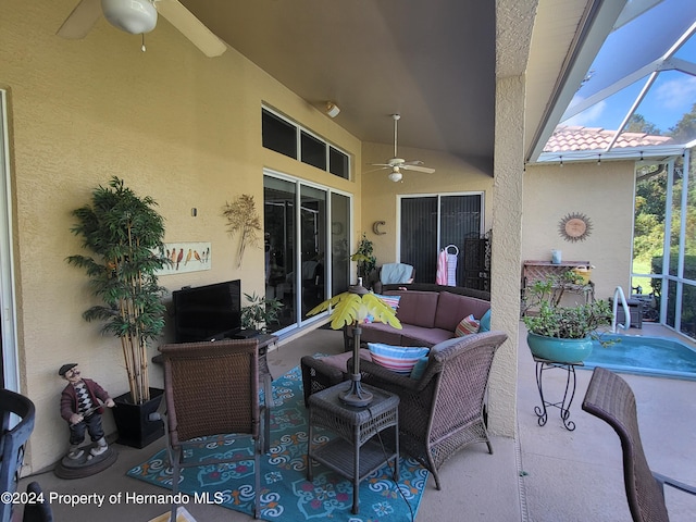 view of patio featuring ceiling fan, a lanai, and an outdoor hangout area