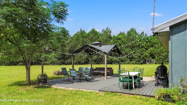 view of patio with an outdoor living space, a grill, and a wooden deck