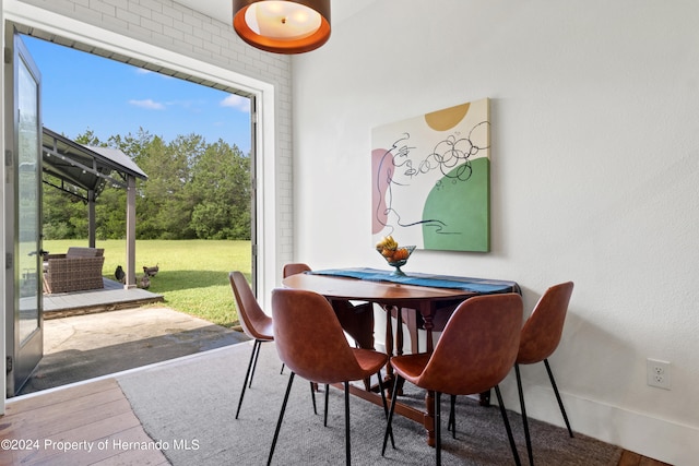 dining area with hardwood / wood-style floors